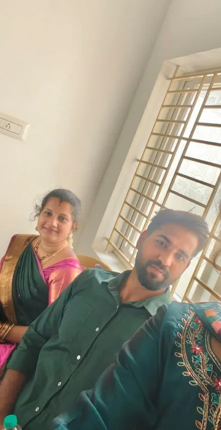 Rajavel and Nivethidha sitting together beside a sunlit window